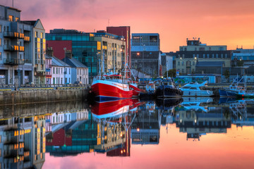 morning view on row of buildings and fishing boats in docks, HDR - obrazy, fototapety, plakaty