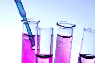 Pipette taking drop into vials