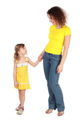 mother and daughter holding for hands looking to each other