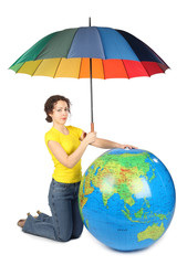 beauty woman sitting and holding umbrella under big globe