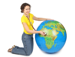 young beauty woman with stethoscope and big inflatable globe