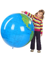 little girl standing and holding big inflatable globe, isolated