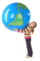 girl standing and holding big inflatable globe over her head