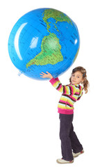 little girl standing and holding big inflatable globe over head