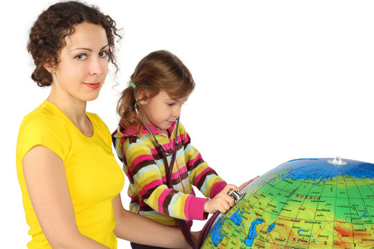 mother and little girl with stethoscope and big inflatable globe