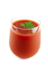 misty glass of cold tomato juice with dill leaf