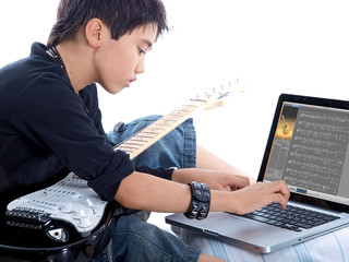 child learning to create digital music