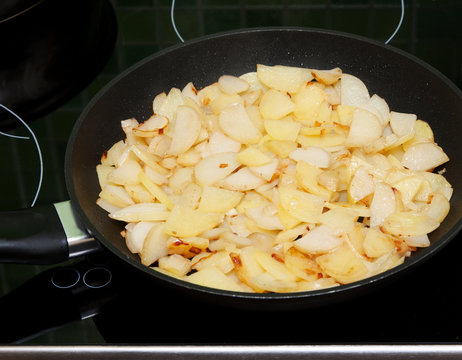 Fried potatoes in pan
