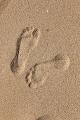 footprints  of man at the beach