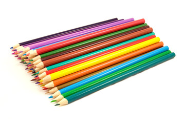 Fototapeta premium pile of multicolored pencils on white background