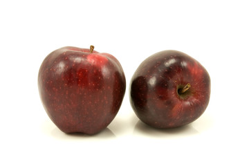 Fototapeta na wymiar two red apples isolated on white background