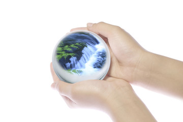 Children's hands on the world.