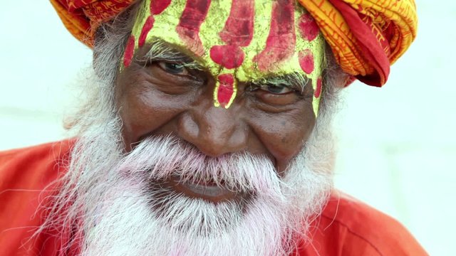 Portrait of a old Sadhu at the ghats in Varanasi, India.
