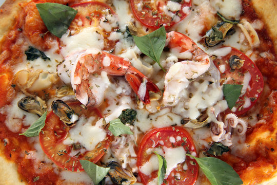 pizza seafood with basil leaf