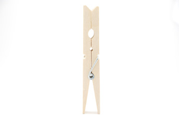The wooden clothespin stand-up on the white background