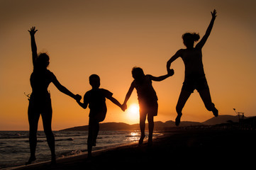Sunset silhouette of family