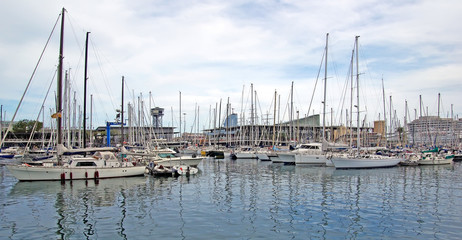Fototapeta na wymiar Yachts and sail boats in Barcelona harbour.