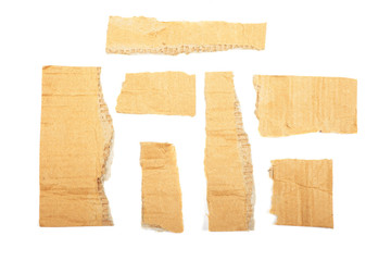 Torn cardboard isolated on white background.