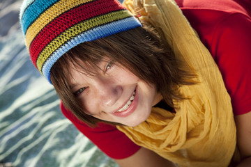 Close-up view at teen girl in rasta cap.