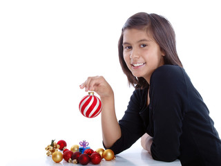 smiling pretty girl holding a christmas ball