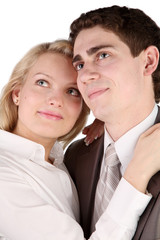 beautiful girl with long hair embraces the young man.