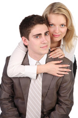 beautiful girl with long hair embraces the young man.