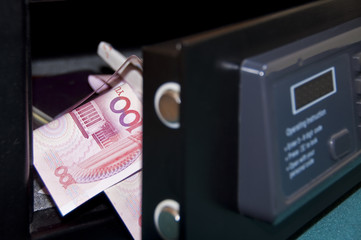 Opened safebox, banknotes