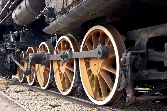 Old locomotive wheels close up. Steam train.