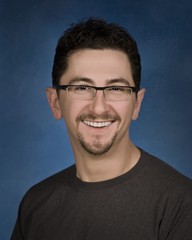 Portrait Of Young Man In Glasses