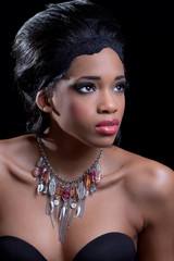 Beautiful young woman wearing stylish necklace