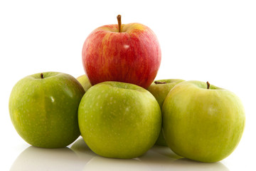 Green apples with one red one