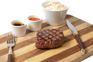 roasted meat on a cutting board. isolated on a white background
