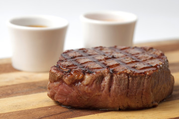 roasted meat on a cutting board. isolated on a white background