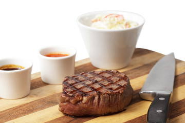 roasted meat on a cutting board. isolated on a white background