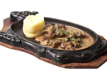 meat in the pan. isolated on a white background