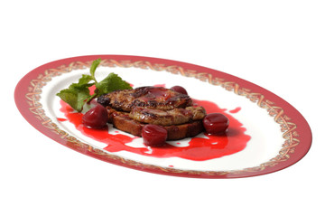 meat in a sweet sauce on a plate. isolated on a white background
