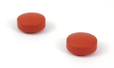 Two generic ibuprofen pain reliever tablets