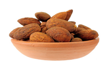 Tamari flavored almonds in a red clay dish