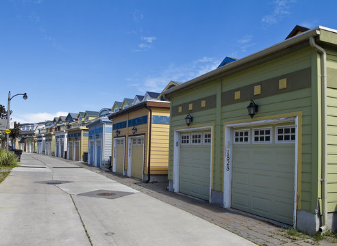 Fototapeta Garages behind row of townhouses