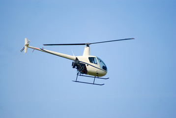 Robinson R-22 helicopter in the air - obrazy, fototapety, plakaty