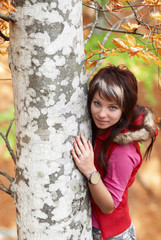 Beautiful girl's portrait near tree