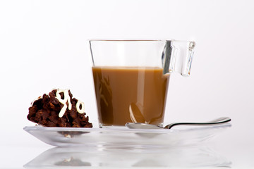 black coffee with milk and a piece of chocolate desert