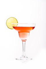 red martini in margarita glass decorated with lime