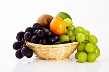 isolated fruits mix in a braided dish