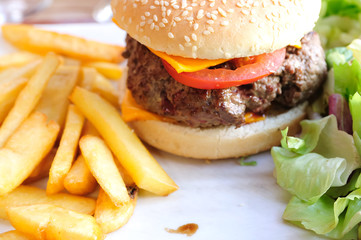 American cheese burger with fresh salad