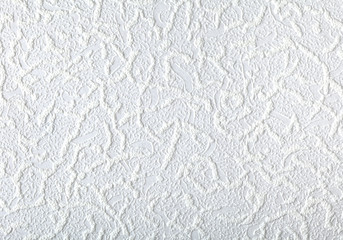 Surface of white wallpaper having the relief