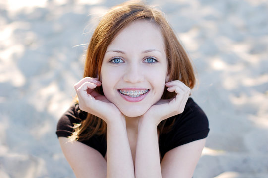 Pretty girl wearing braces smiling cheerfully