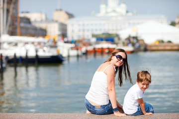 Mother and son in city center Helsinki Finland