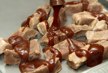 applying bbq sauce