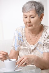 Senior woman drinking coffee